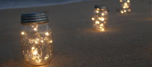 Mason jar fairy lights on beach