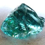 A chunk of raw aqua-blue glass