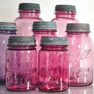 Pink-tinted Ball Perfect Mason jars with zinc lids